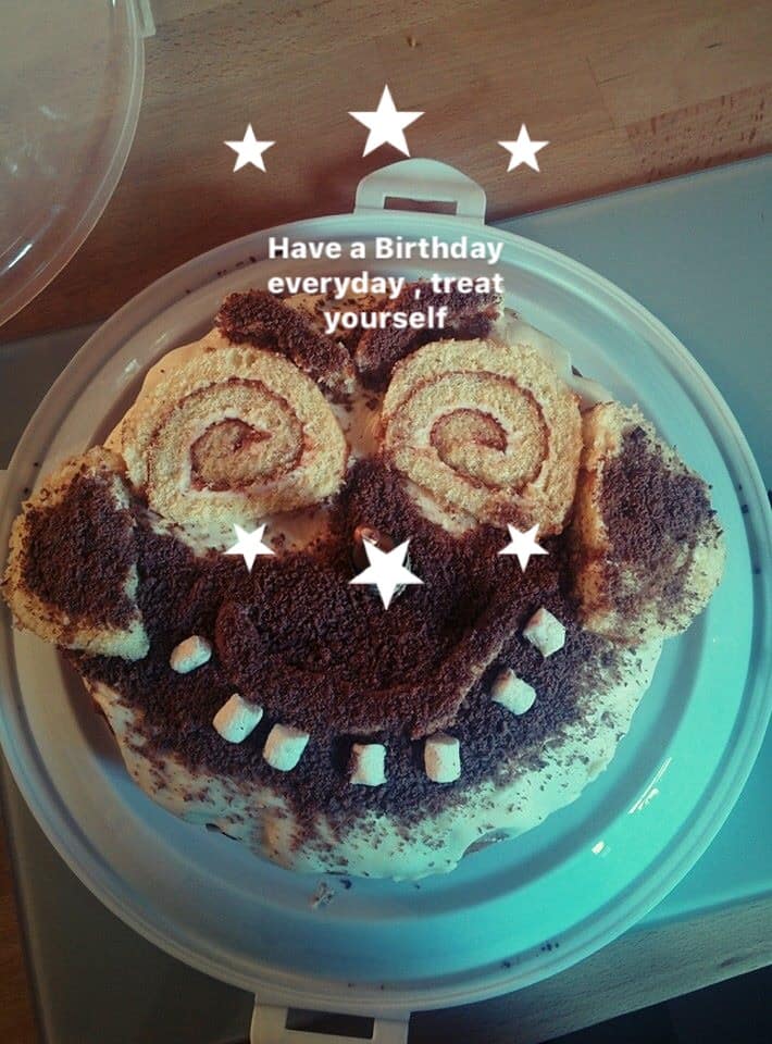 Treat yourself Swiss roll cake decorated with a smiley face